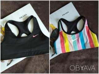 Двохсторонній якравий та чорний спортивний топ на поролоні, р.32-34, Nike